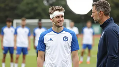 A photorealistic image of a young KV Mechelen defender, aged 20-25, with a bandage on his head, looking concerned, in a...