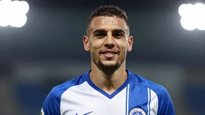 A photorealistic image of an anonymous KV Mechelen player in action